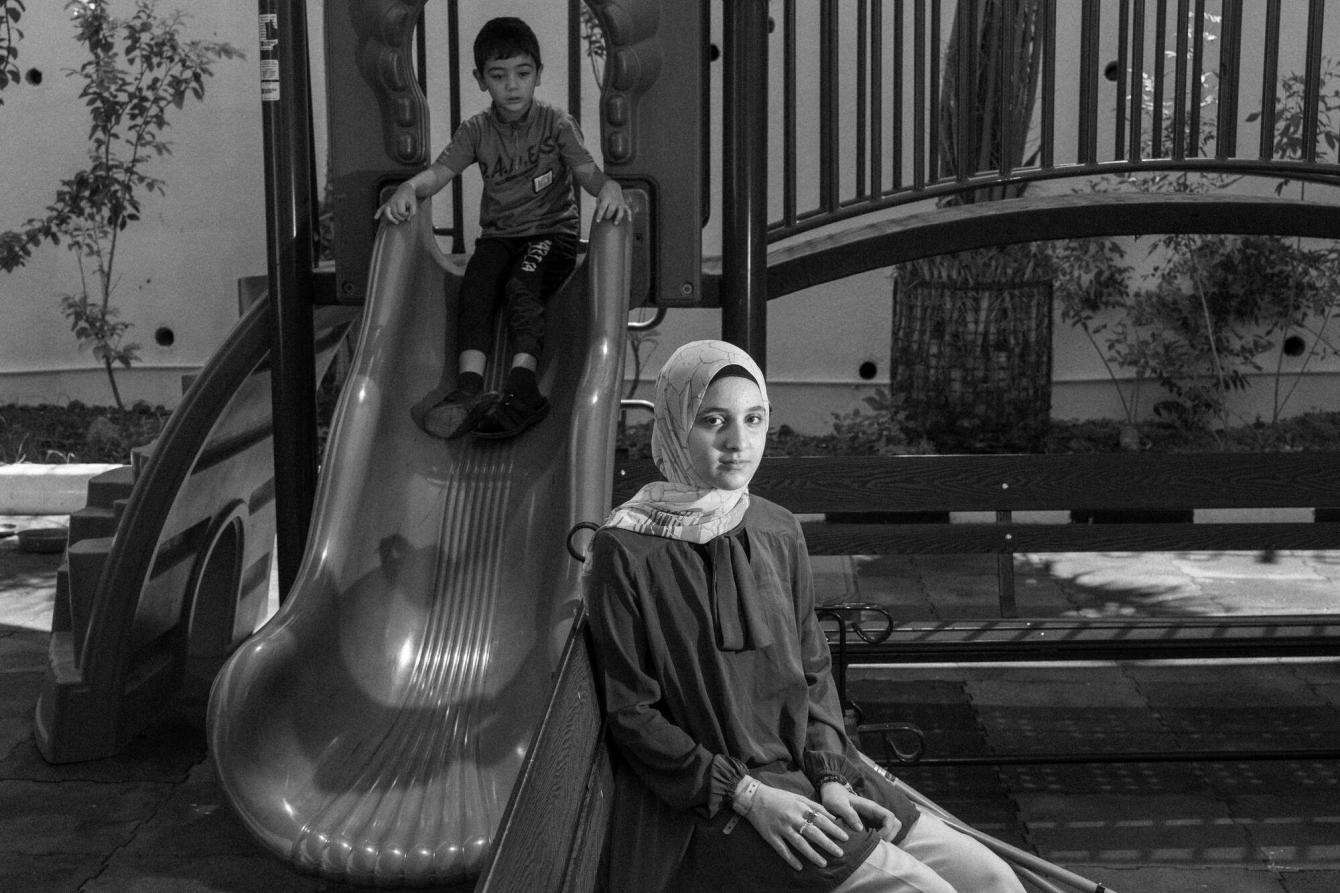 A girl and boy at a playground in the MSF hospital in Amman.