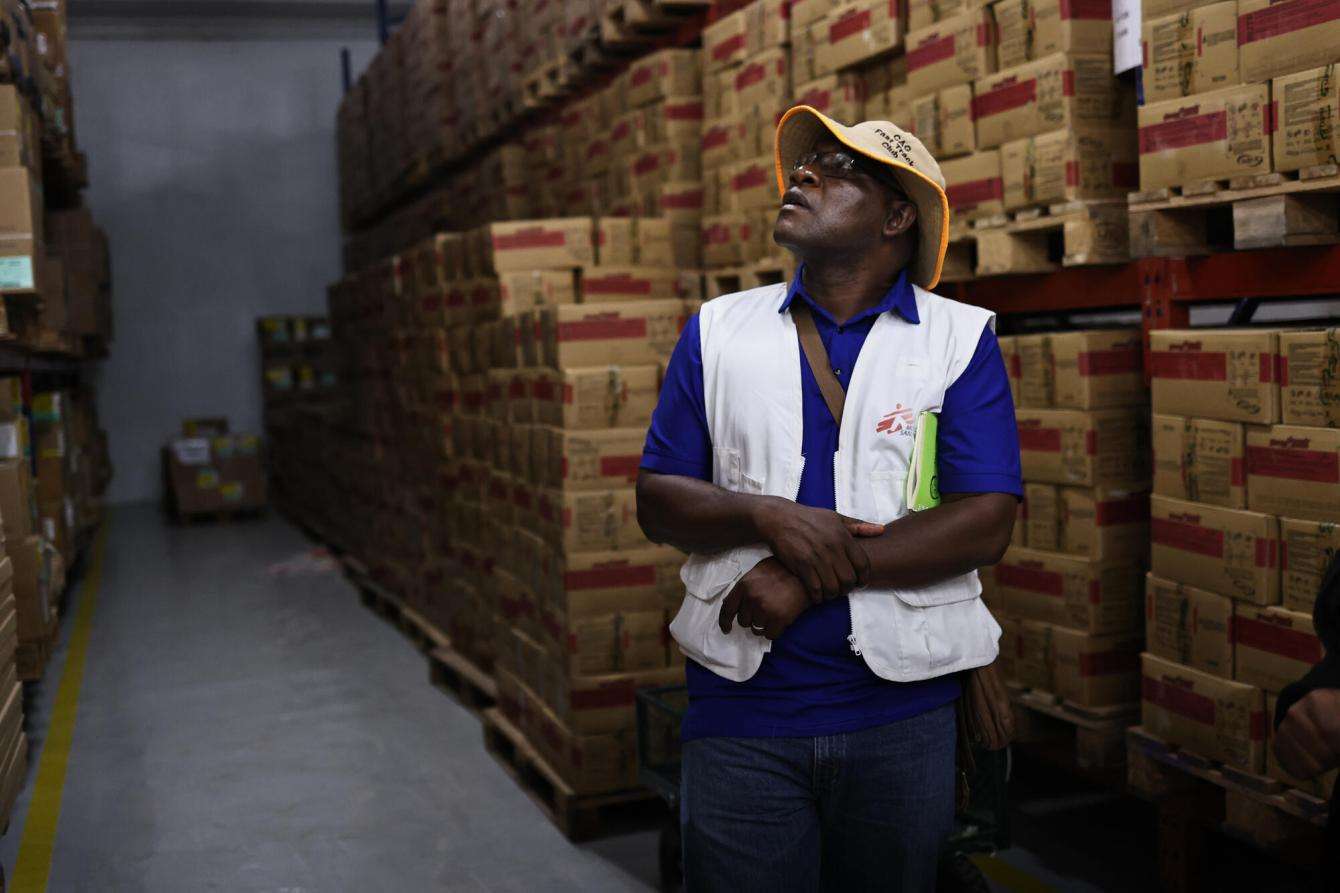 MSF project coordinator Huggins Madondo inspects ready-to-use therapeutic food stocks stored at MSF's medical warehouse in Birnin-Kebbi, the capital of Kebbi state.